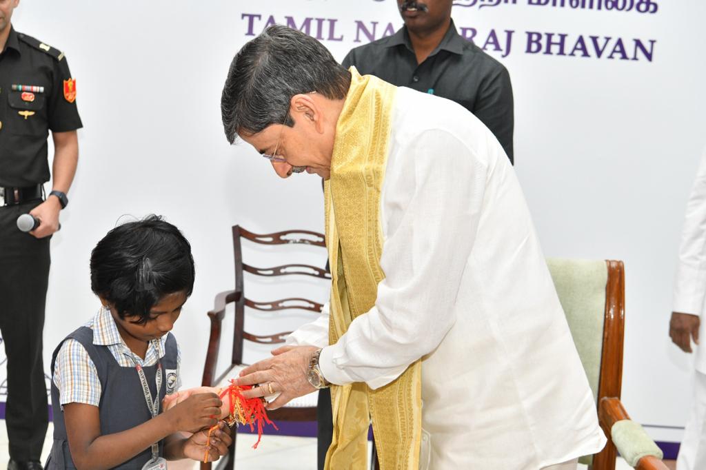 In a heartwarming gesture that epitomizes the spirit of unity and tradition, Lakshitha, student of Std. 2 at Velammal Vidyalaya, Karambakkam had the honor of tying a sacred rakhi on the wrist of the Governor of Tamil Nadu, R.N. Ravi, on the auspicious occasion of Raksha Bandhan. By extending the rakhi to a prominent state figure, she not only upheld the tradition but also showcased the values of respect, love, and reverence for authority. This remarkable gesture by Lakshitha is a testament to the school's efforts in nurturing socially responsible and culturally aware individuals.